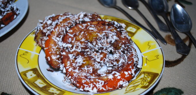 Kandyzowane pomarańcze w czekoladzie posypane wiórkami kokosowymi